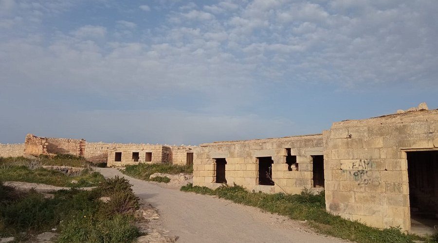 existing fort blocks at sunset, the perimeter wall under raking light